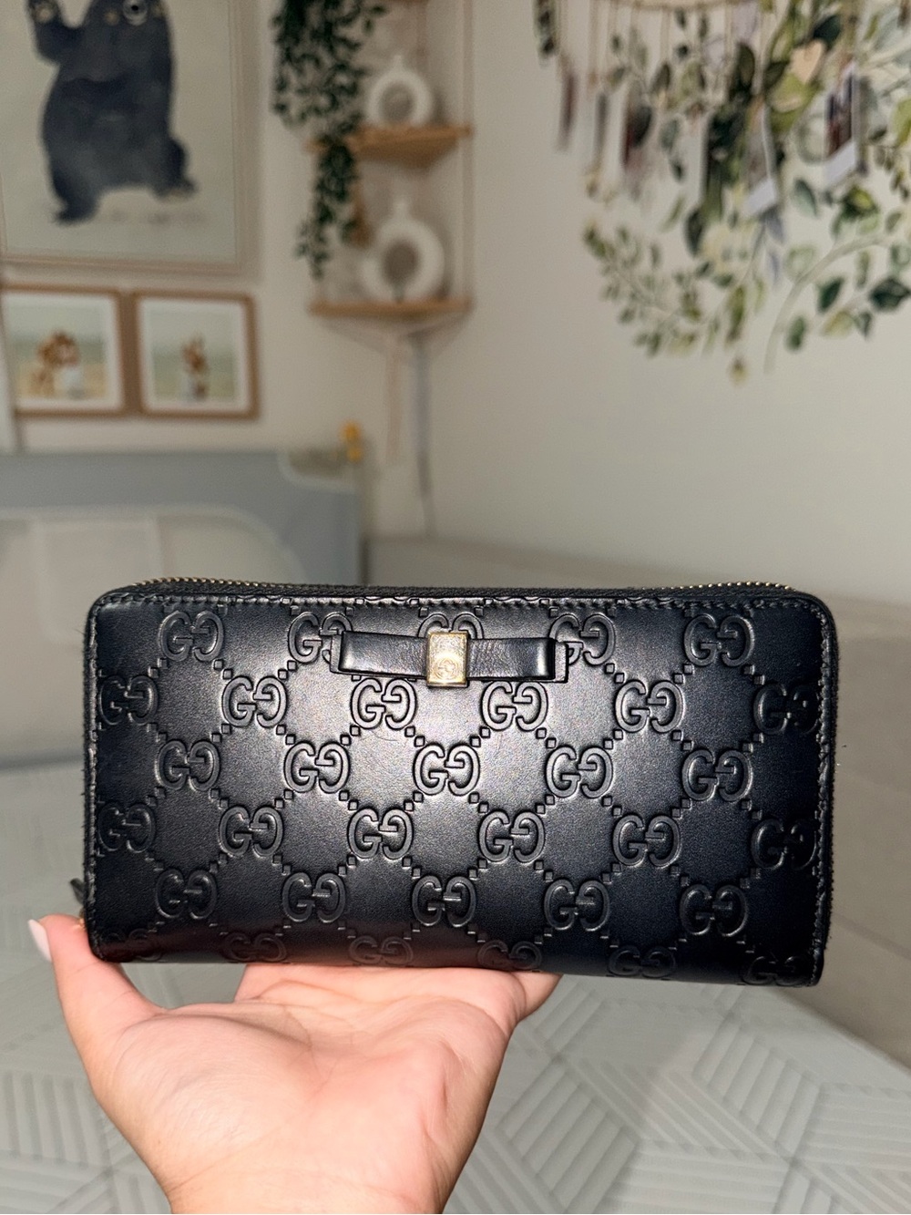 Gucci Black Embossed GG Zip Wallet with Gold Accent